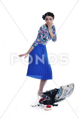 Stock photo of pinup retro woman with travel bag isolated