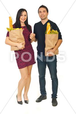 Stock photo of Young couple shopping food