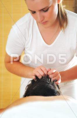 Stock photo of head and hair massage at the spa and wellness center