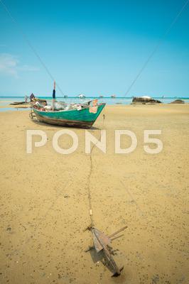 Stock photo of Fishing boat at low tide