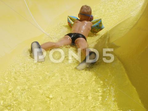 Stock photo of happy child play on pool