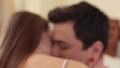 Young couple tenderly kissing in bedroom, romance, true love Video
