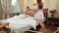 Wife bringing tray with Japanese sushi to husband in bed Video