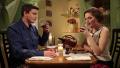 Funny young couple in pajamas having romantic dinner at home Video