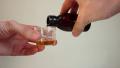 Pouring medicine into measuring cup, ill person taking meds Video