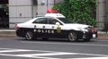Tokyo Police Car With Flashing Lights Parked On Street 4K Video