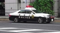 Tokyo Police Car With Flashing Lights Parked On Street HD Video