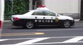 Tokyo Police Car With Flashing Lights Sideview 4K Video
