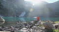 Male traveler enjoying beautiful view on blue mountain lake Video