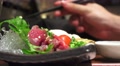 Mans Hand With Chopsticks Before He Picks Up A Peice Of Meat 4K Video