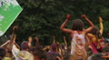 Adults and children dancing, jumping, waving hands at festival Video