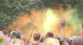 Happy people throwing colorful powder in the air at festival Video