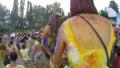 Young girls sitting on boyfriends' shoulders at festival, slowmo, click for HD Video