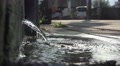 Water Pours Out To Sidewalk From Concrete Wall HD Video
