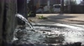 Water Pours Out To Sidewalk From Concrete Wall 4K Video