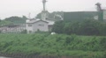 Industrial Buildings On Tama River On Rainy Foggy Day Zoom Out HD Video