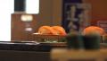 Japanese Salmon Nigiri Sushi On Food Conveyor Belt In Tokyo Restaurant 4K Video