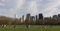 UHD 4K Central Park People Kids Play Ball Family Lying Grass Lawn NYC Skyline Video