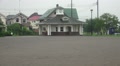 Kids Hang Out By Japanese Civic Building With Clock Tower And Sports Feild HD Video