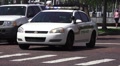 Police Car Flashing Lights Daytime Brick Road HD Video