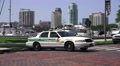 Police Car On Brick Road Tampa Bay Marina And City Skyline HD Video