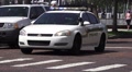 Police Car Flashing Lights Daytime Brick Road 4K Video