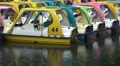 Empty Colorful Tourist Paddle Boats - Rainy Day On Lake 4K Video
