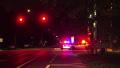 Police Cars With Flashing Lights At Stop Light At Night HD Video