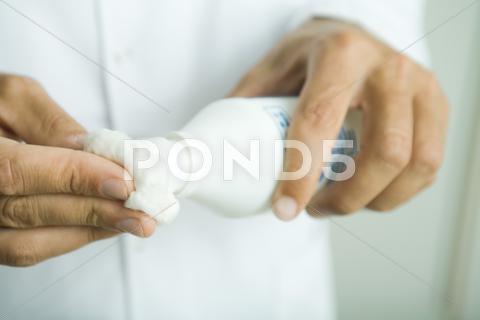 Doctor Putting Antiseptic On Cotton Ball, Close-Up Of Hands