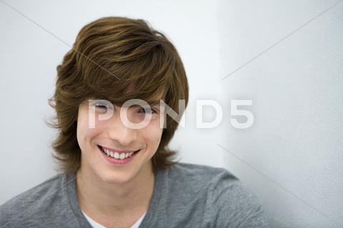 Young Man Smiling At Camera, Close-Up, Portrait