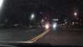 Car POV Driving Down City Street At Night To Flashing Police Lights 4K Video