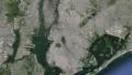 Aerial of man lying on grass, extreme zoom-out, Earth globe Video