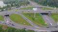 Bridge over busy highway junction, heavy traffic, aerial shot Video