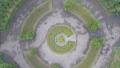 Aerial vertical shot of flower-bed in park, extreme circling Video