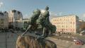 Flying around statue of historic person, city attraction, aerial Video