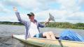 Happy couple paddling kayak, having fun. Home video, vacation Video