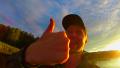 Male traveler showing thumbs up at camera, amateur video, fun Video