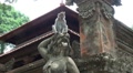 Macaque monkey climbing on Bali temple figures Video
