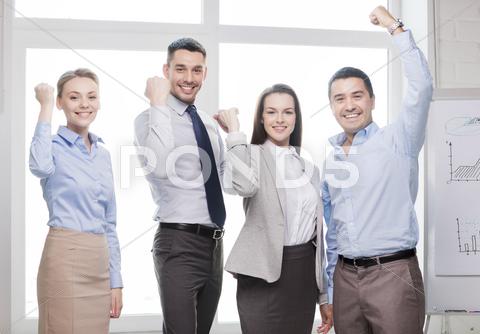 Business Team Celebrating Victory In Office