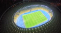 Football players on large stadium field, match, sports, aerial Video