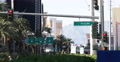 Establishing Shot Red Traffic Light Sign People Walk MGM Hotel Board Las Vegas Video