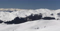 Panoramic Shot Aerial View Pan Left Winter Landscape Snow Covered Cold Mountains Video