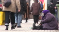 Beggar old woman on street. Kiev, Ukraine, City life in winter Video
