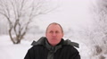 Winter time . Adult man look and smile .Portrait Video