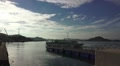 Passenger Boat Leaves Dock At Harbor Mountain Island At Sunset Beautiful Sky HD Video