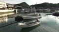 Row Boat In Fishing Village Harbor With Reflections Of Clouds And Sky HD Video