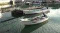 Rowboat Dingy In Harbor With Reflections Of Clouds And Sky HD Video