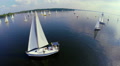 Sailing yachts in open sea, sailors on deck. Regatta, aerial Video
