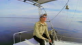 Young smiling guy yachtsmen, sailing yacht in sea, active rest Video