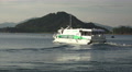 Passenger Ferry Boat Sails By Mountain Island 4K Video